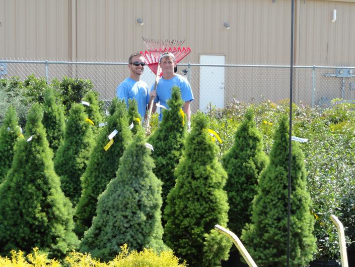 Jacob and Chase are working in the shrub area keeping the lot nice and organized