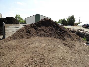 Adams Nursery & Landscaping sells brown hardwood mulch in bulk and by the bag.