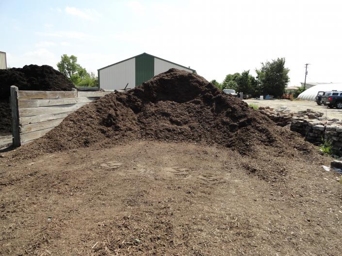 Brown Hardwood mulch is a good top dressing for shrub beds and around trees. This is one of two types of bulk mulch sold at Adams Nursery & Landscaping in Paragould.  It is sold by the scoop which is equal to 1/2 cu yd.