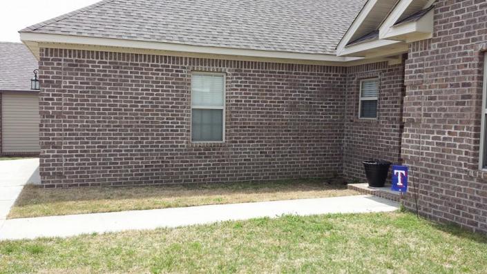 Sam and Jerica's yard before the Texas Ranger inspired landscaping.